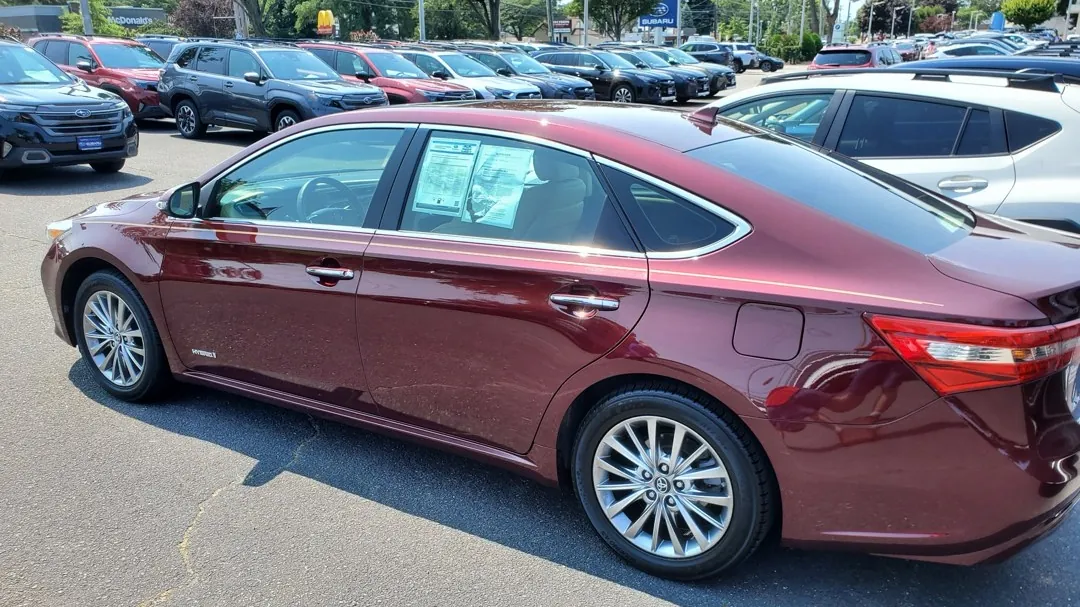 A hybrid sedan on a lot during a pre purchase inspection.